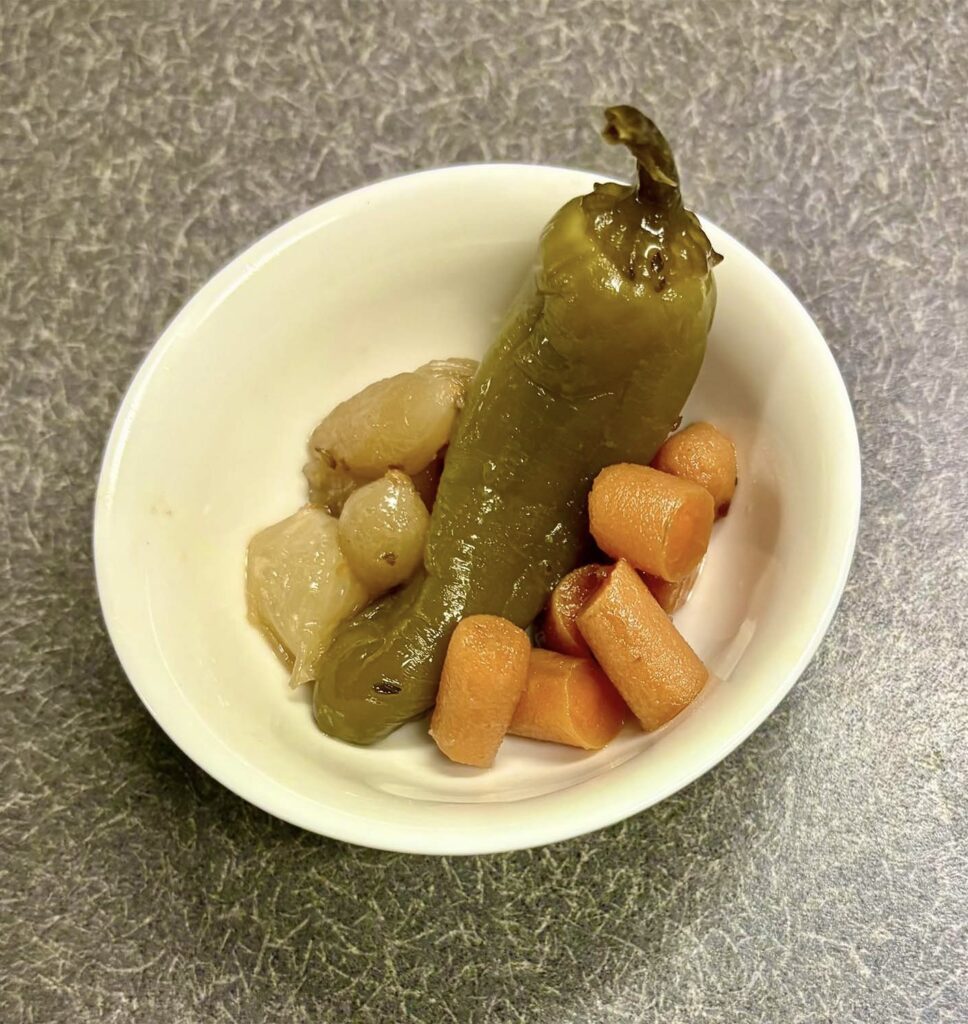 Photo of Pickled Jalapeno Pepper with onions and carrots. 