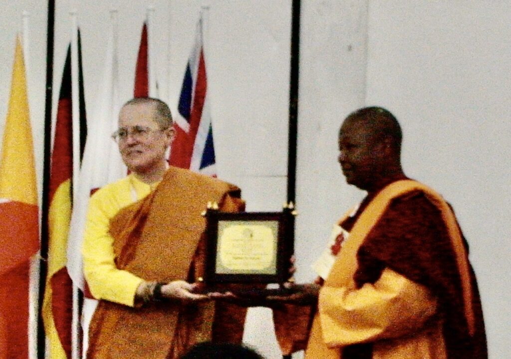 Photo of Ven. Pannavati receiving Outstanding Women in Buddhism Award, Bangkok, Thailand, March 2009.