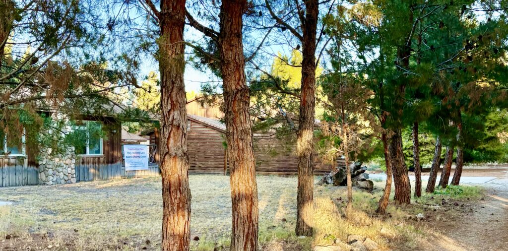 Photo of View from the lake of the frontage road and the temporary home of the Holy Heavenly Lake Xuanfa Dharma Center, Hesperia, California.  