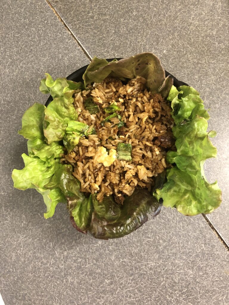 Photo of Tofu with Gochujang Sauce fried with Rice and Egg and served with Lettuce Wrappers.