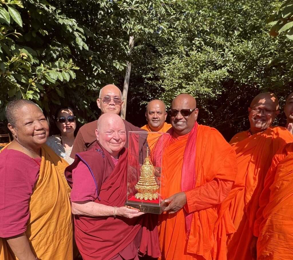 Photo of Ven. Chandima gifting the Holy Vajrasana Temple with a golden stupa from Sri Lanka. 