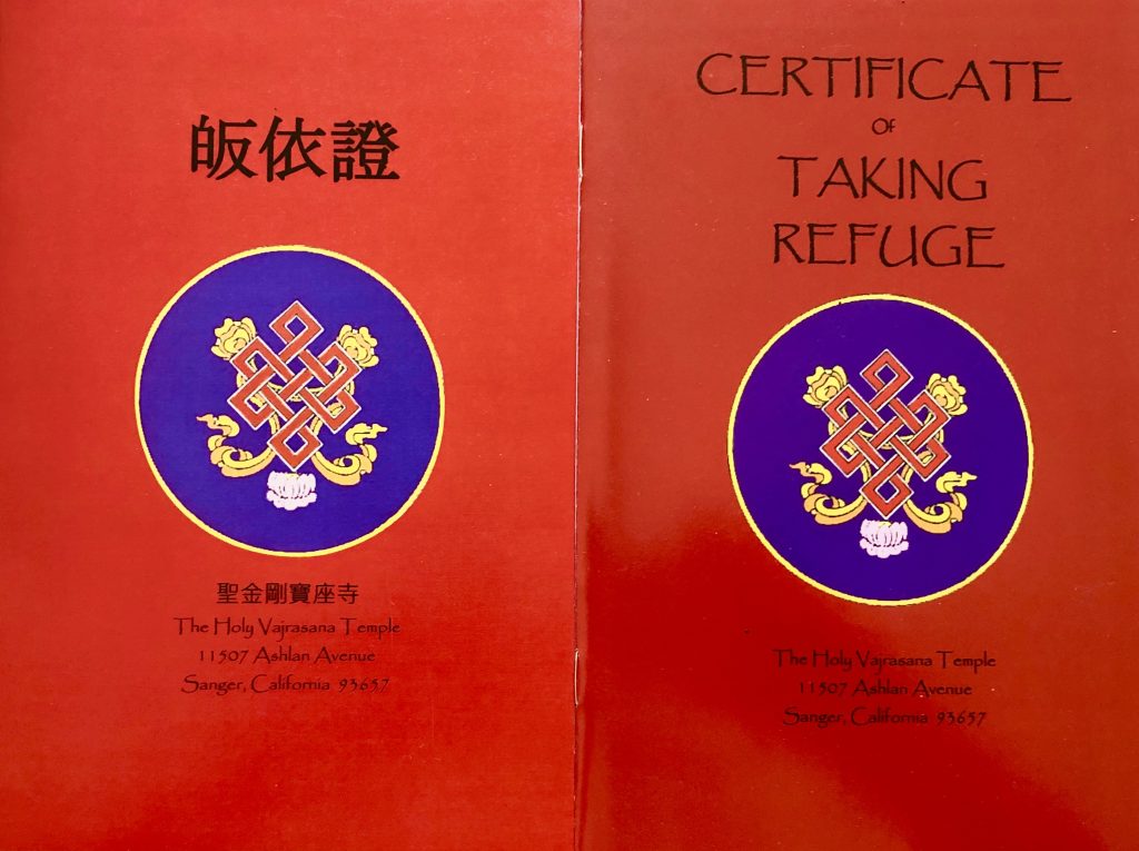 Photo of Refuge Certificate booklet in English and Chinese.