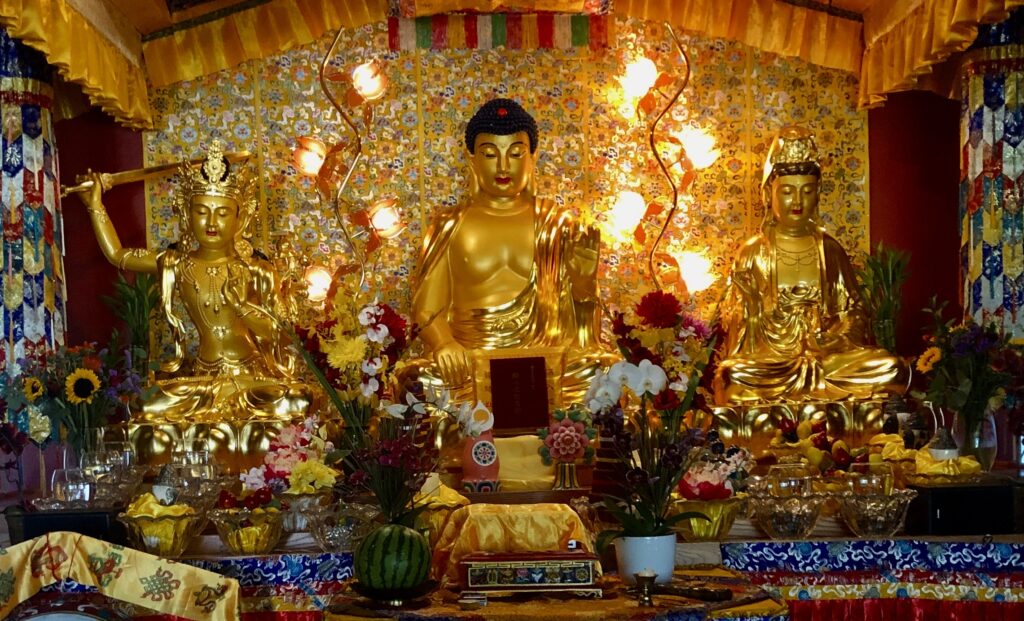 Holy Vajrasana Temple, Buddha Hall with "Imparting the Absolute Truth through the Heart Sutra" in front of the Buddha.