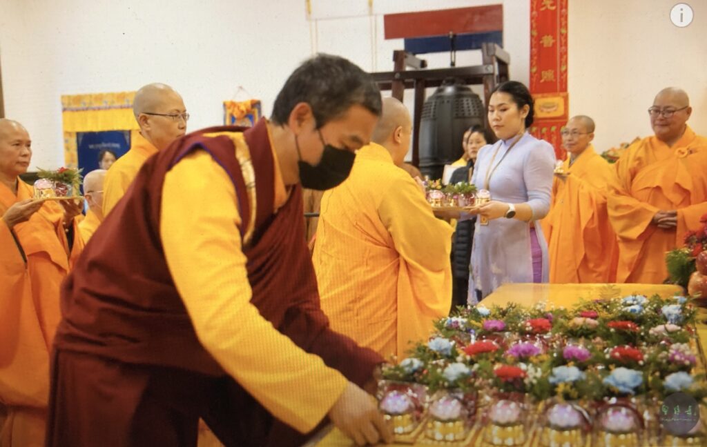 Photo of Rinpoche making offering at Lunar New Year Prayer at Holy Miracles Temple, Pasadena, CA