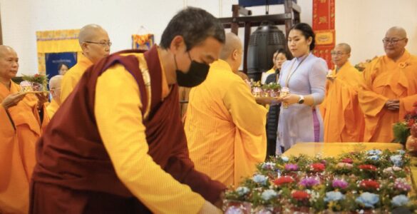 Photo of Rinpoche making offering at Lunar New Year Prayer at Holy Miracles Temple, Pasadena, CA